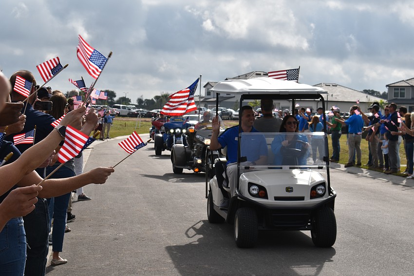 Those who came to honor Army Sgt. Lucio Gaytan lined the street in Sapphire Point during a short parade before the ceremonies began.