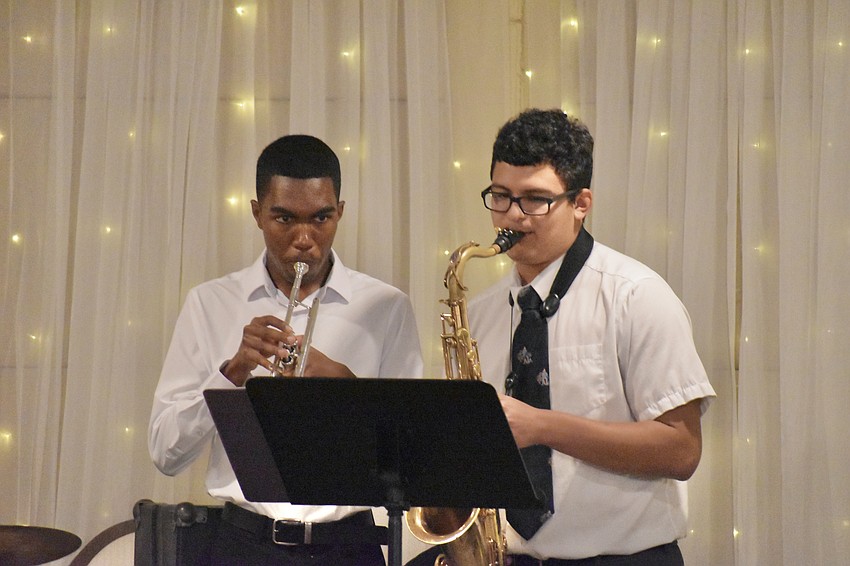 SCF Presidential Jazz Combo members Jayden Titus and Isaac Ceciliano perform at the fashion show.