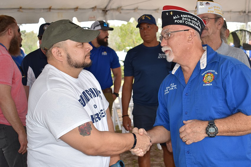 Retired Army Sgt. Lucio Gaytan visits with Dave Daily of VFW Braden River Post 12055.
