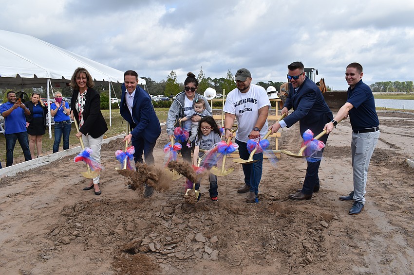 SMR's Laura Cole, Pulte's Josh Graeve, Ivette, Lyanna, Lucious, and retired Army Sgt. Lucio Gaytan, Pulte's Wes Copeland and Building Homes for Heroes' Cody Brannon break ground for the Gaytan's new home at Sapphire Point Feb. 3 in Lakewood Ranch.