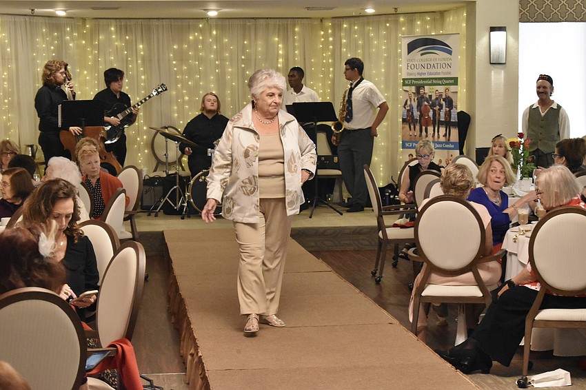 Palm Aire's Peg Beck brings a touch of gold to the event.