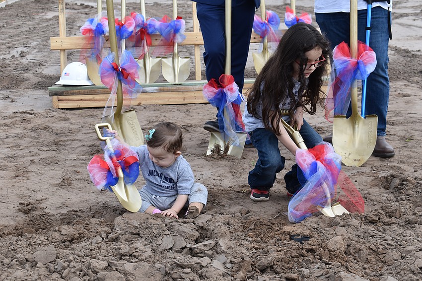 Lyanna Gaytan, 1, and Lucious Gaytan, 5, enjoy the groundbreaking ceremonies Feb. 3 to commemorate the gift of a home to their family through a partnership of PulteGroup, Building Homes for Heroes and Schroeder-Manatee Ranch.