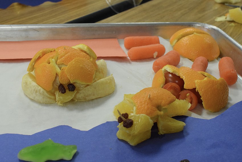 Turtles, made out of orange slices and orange peels, are on display.