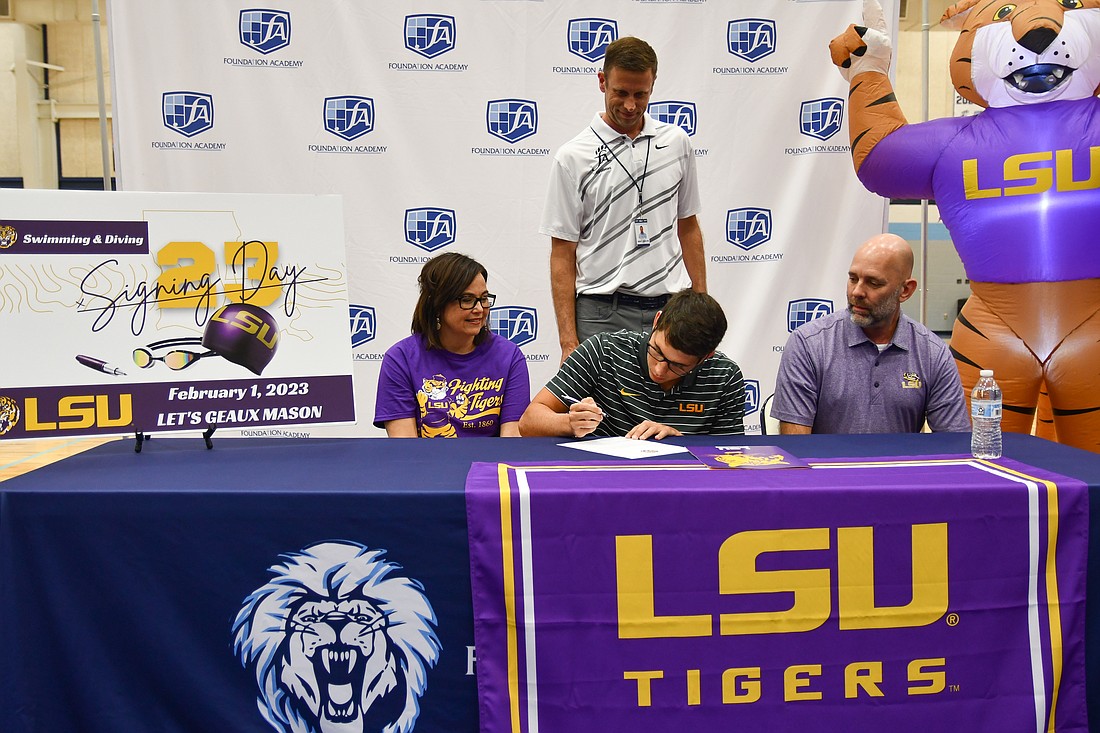 Mason Williams signed his NLI with Louisiana State University accompanied by his coach, Chad Sundermeyer, and his parents.