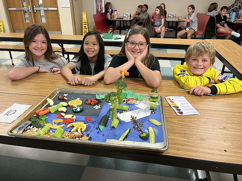 Fourth graders Kinsley Ross, Brianna Nguyen, Trinity Miller and Connor Beckley celebrate their third-place finish.