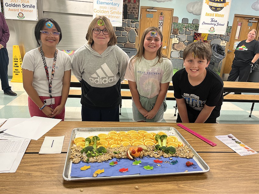 Fifth graders Kaitlyn Do, R.J. Griffis, Kinley Chupp and Micah French celebrate their first place win. They'll move on to compete against winners from seven other elementary schools in the School District of Manatee County.