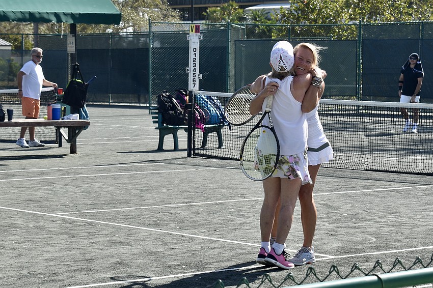 Sandy Campbell and Shannon Elliot hug after their big win.