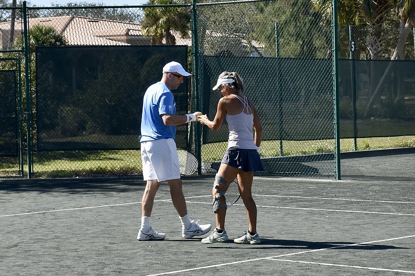 John Hutchens and Angie Eason fistbump during the finals.