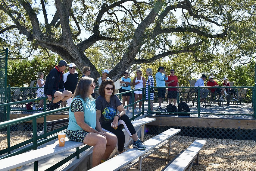 Spectators enjoy the tournament and weather on Sunday.