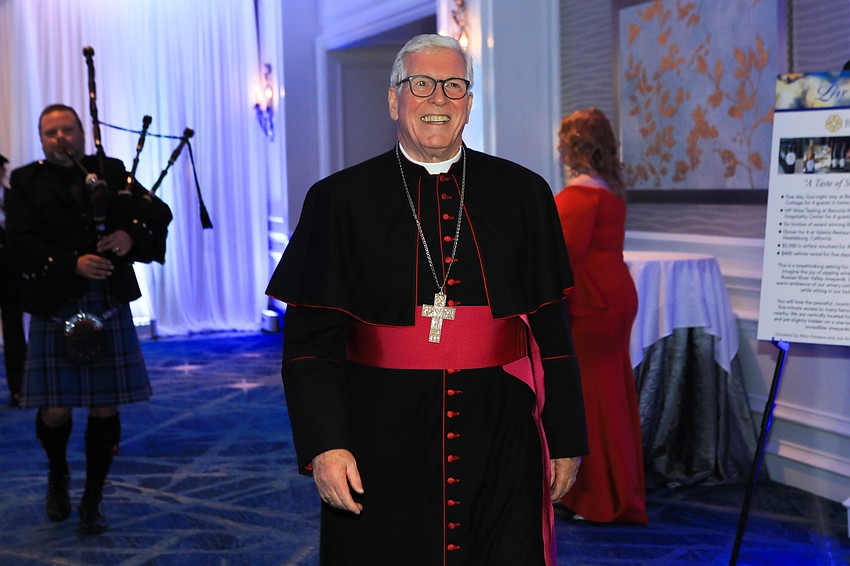 Rev. Frank J. Dewane arrives.