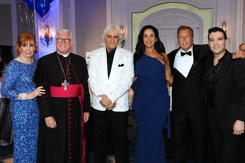 Chairwoman Bridget Speiss, Rev. Frank Dewane, pianist Giovanni Marradi, Mary Beth and Ralph Cotran and Edgar Sandoval