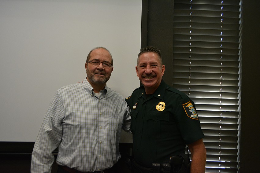 Tom Harmer stands with Sarasota County Sheriff Kurt Hoffman at his retirement party Monday morning.