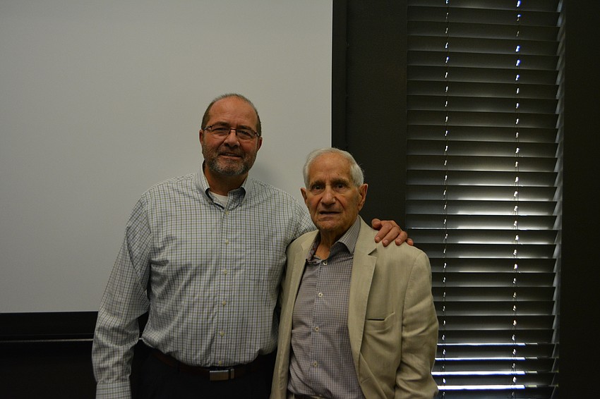 Tom Harmer stands with Carmine Durzo, who was his neighbor throughout his tenure on the barrier island.