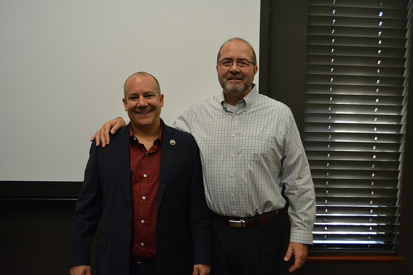 Manatee County Commissioner Kevin Van Ostenbridge stands next to Tom Harmer.