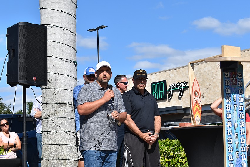 Officer Tim Dederick takes a moment to thank the community members for supporting his family.