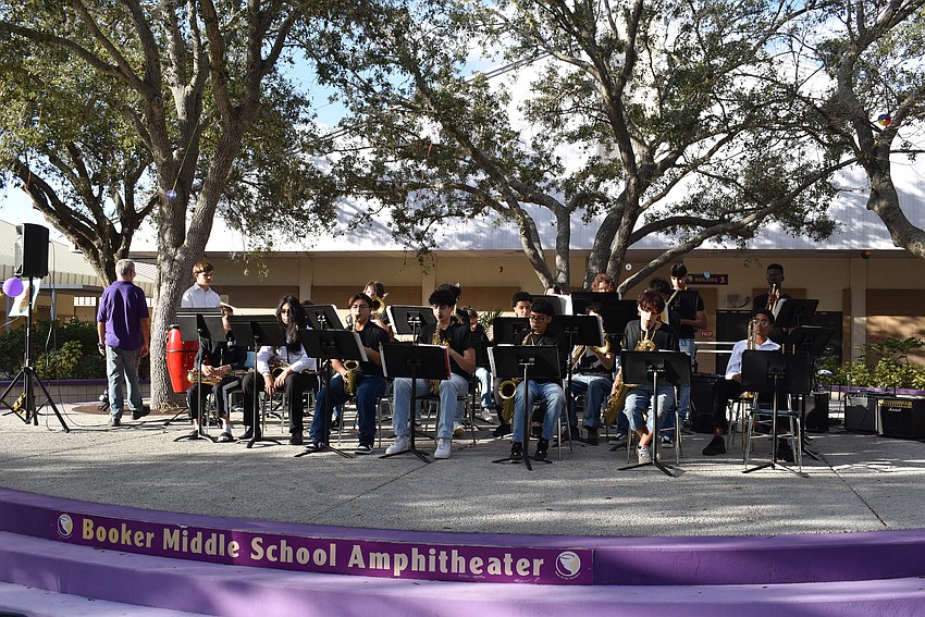 Booker High School band cats play licks for the community members.