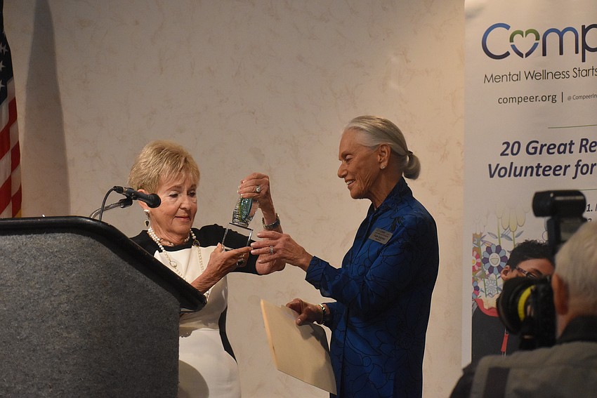 Bunny Skirboll presents an award to Faith Goldman.