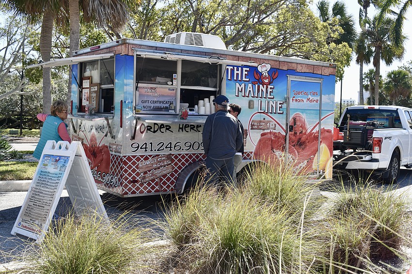 The Maine Line food truck serves lobster rolls to hungry shoppers.