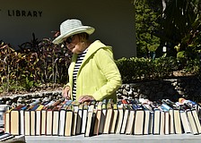 Barbara Claudy shops at the Longboat Library book sale on Saturday.