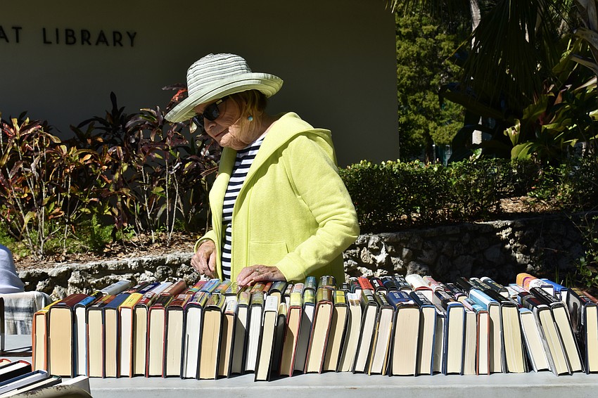 Barbara Claudy shops at the Longboat Library book sale on Saturday.