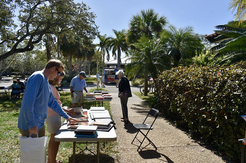 The Longboat Library brings their inventory outside for a book sale.