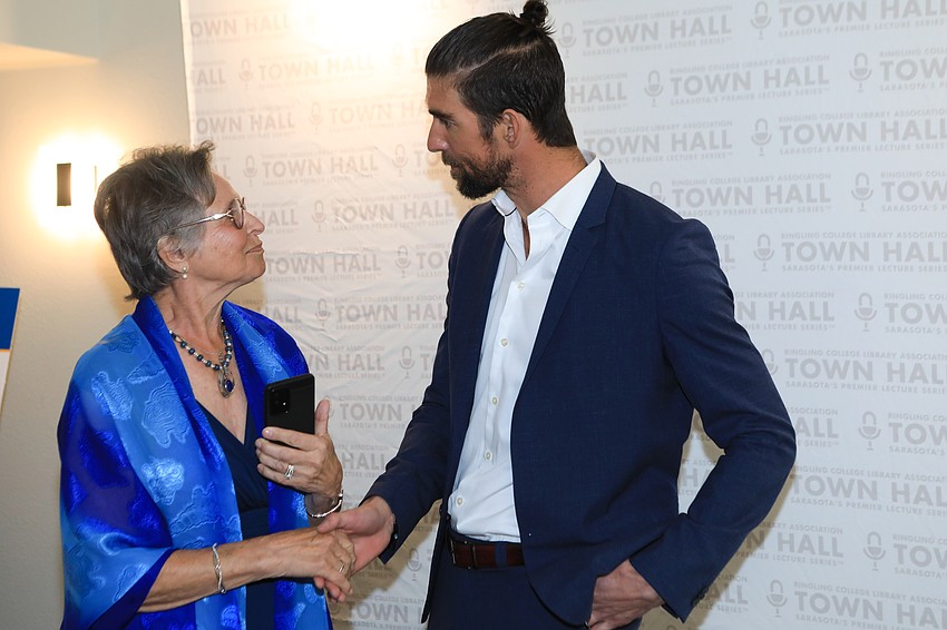Julie Osbourne chats with Michael Phelps.