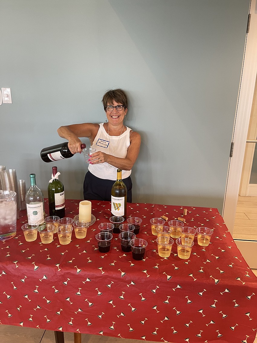 Marie Pozantides working the wine table.