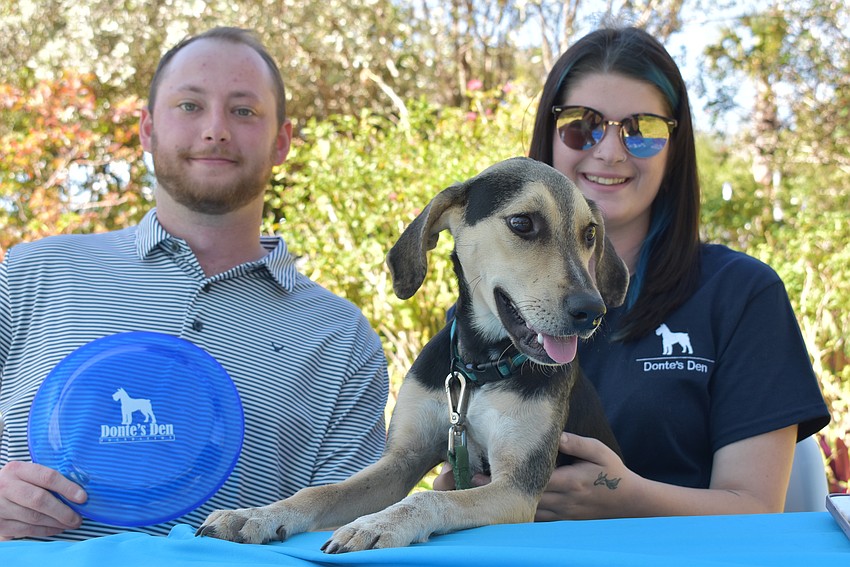 Nick Panuce, Snoopy and Haley Oler work the Donte's Den booth.