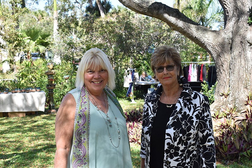 Christy May and Christine Pratley stroll through the garden and shop the local vendors.