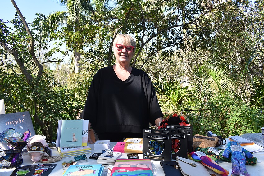 Judith Horn works the Evelyn & Arthur booth.