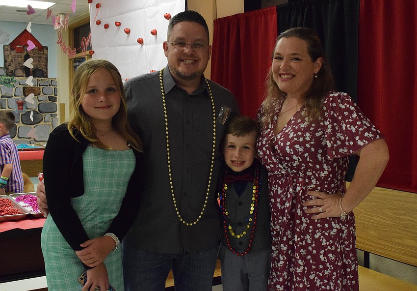 Fifth grader Isabella Carberry, Kevin Carberry, third grader Logan Carberry and Traci Carberry love being together at the sweetheart dance, which is Isabella Carberry's last before moving onto middle school.
