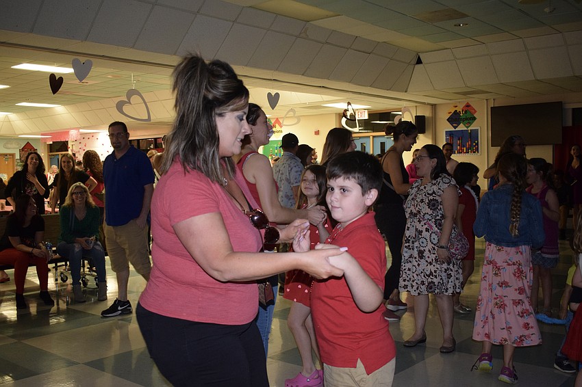 Colleen Fackler dances with her first grader Declan Fackler. 