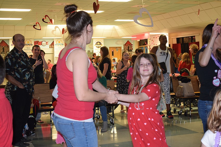 Alison Bowman dances with her third grader, Hailey Bowman. 