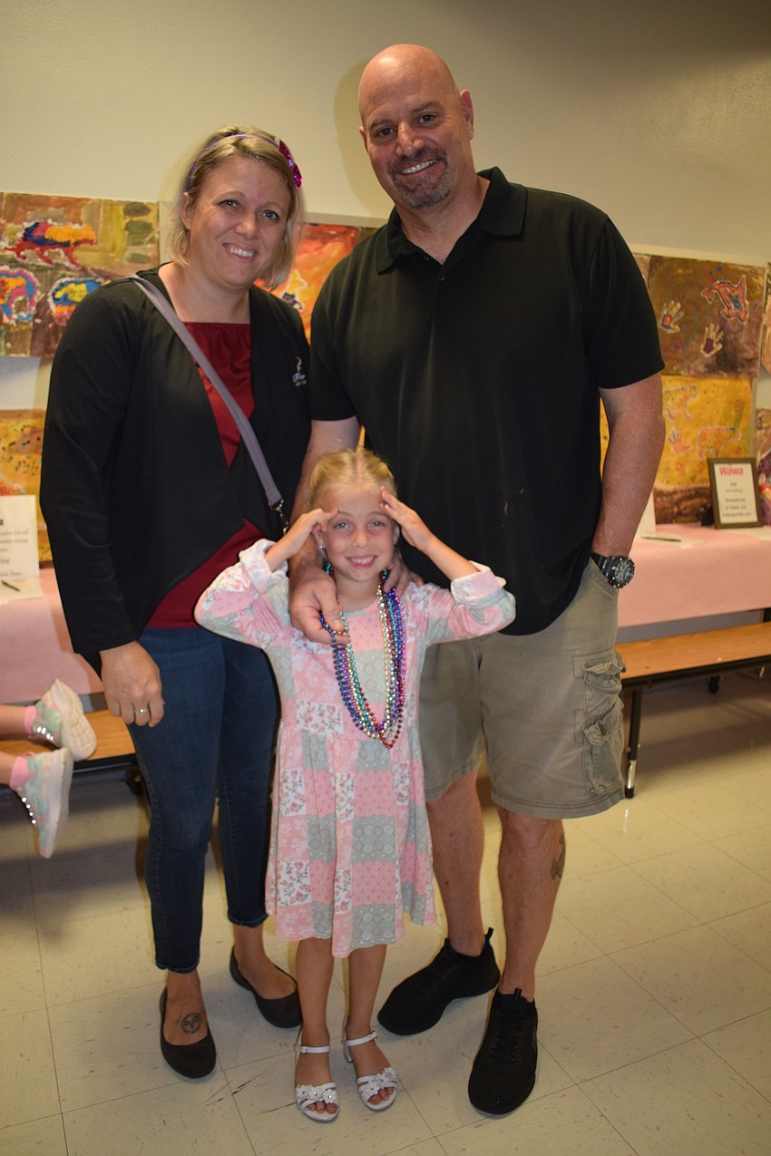 Samara Withrow and Dave Withrow have fun taking their daughter Allie Rose Withrow, who is in kindergarten, to her first sweetheart dance. 