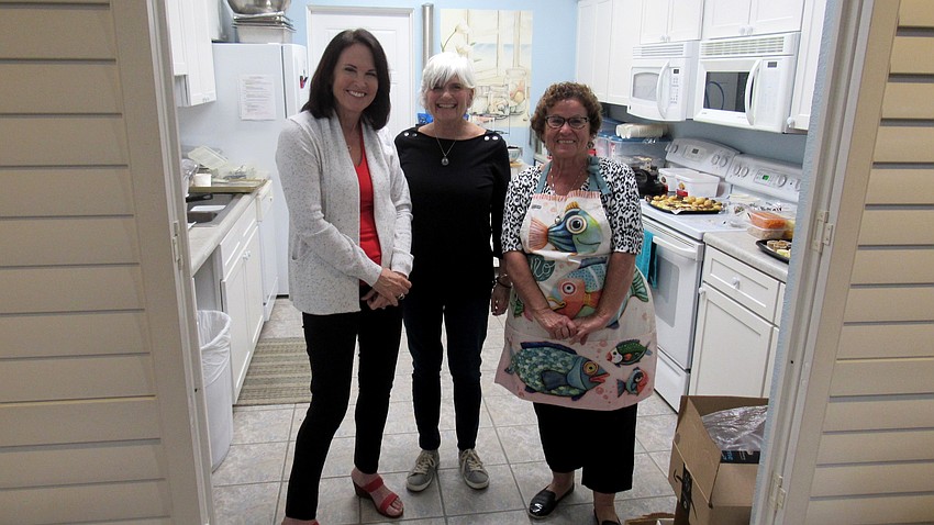 Margaret Dugan,  Lindy Jacobi and Judy Behny prepare for the soup and chili cook-off.