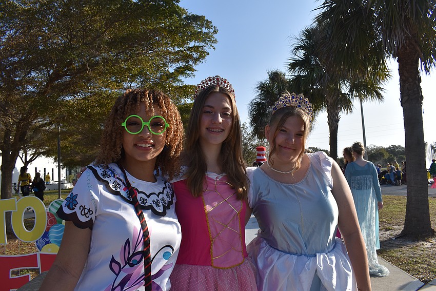 Disney Princess Mirabel, Aurora and Cinderella welcomes families to Storybook Street.