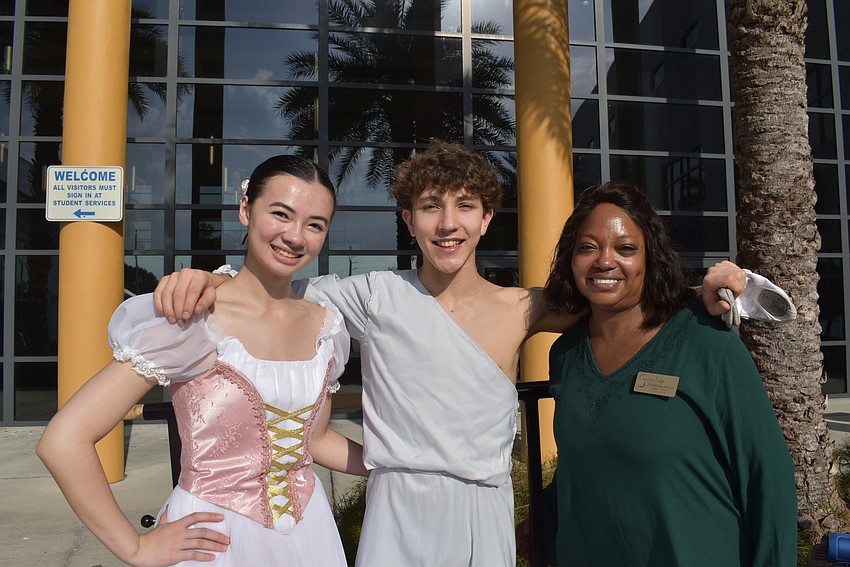 Emilina Jarvis, Jason Shuman and Sarasota Ballet Dance for All Program Director Doricha Sales greet families at the Sarasota Ballet booth.