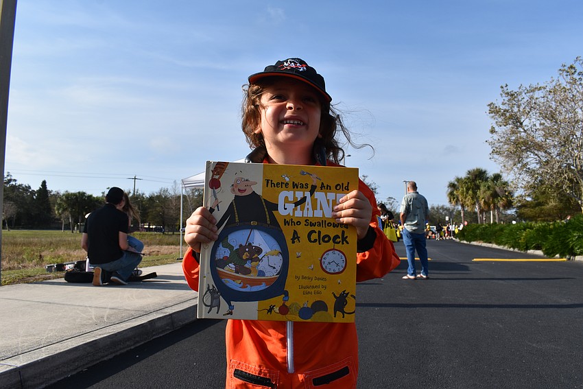 Roman Miller dresses as an astronaut for Storybook Street.