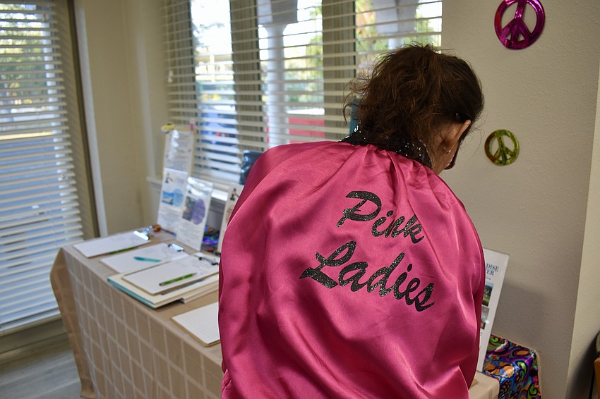 Pink Lady Irina LaRose at the silent auction table.