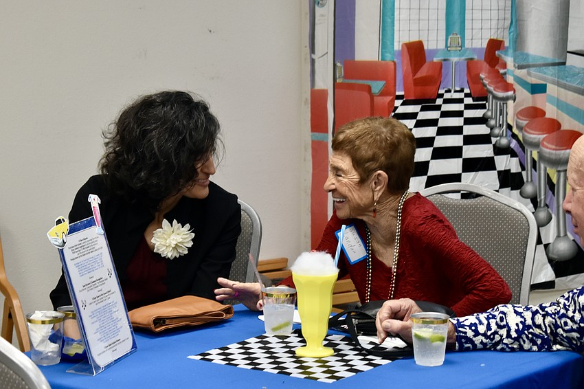 Melody Mora-Shihadeh and Susan Landau share a laugh.