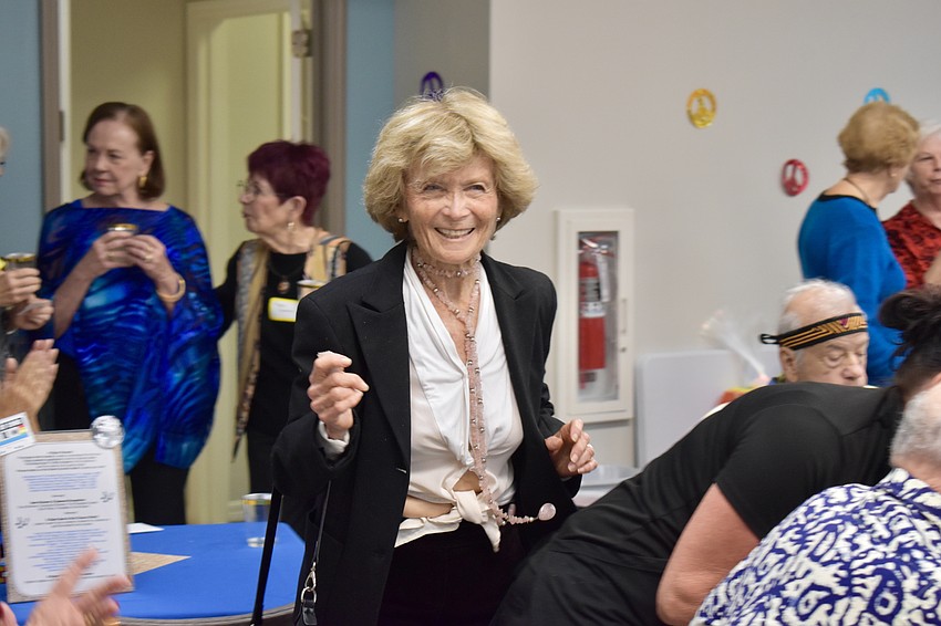 Anita Lieberson walks up with her winning ticket.