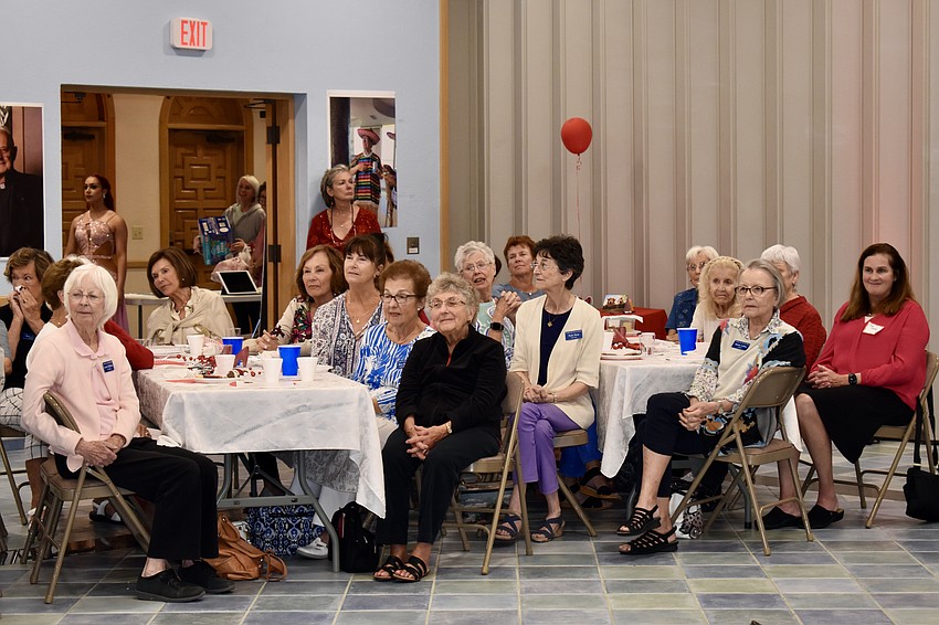Members of the ladies guild enjoy the performance by the Dynasty Stars.