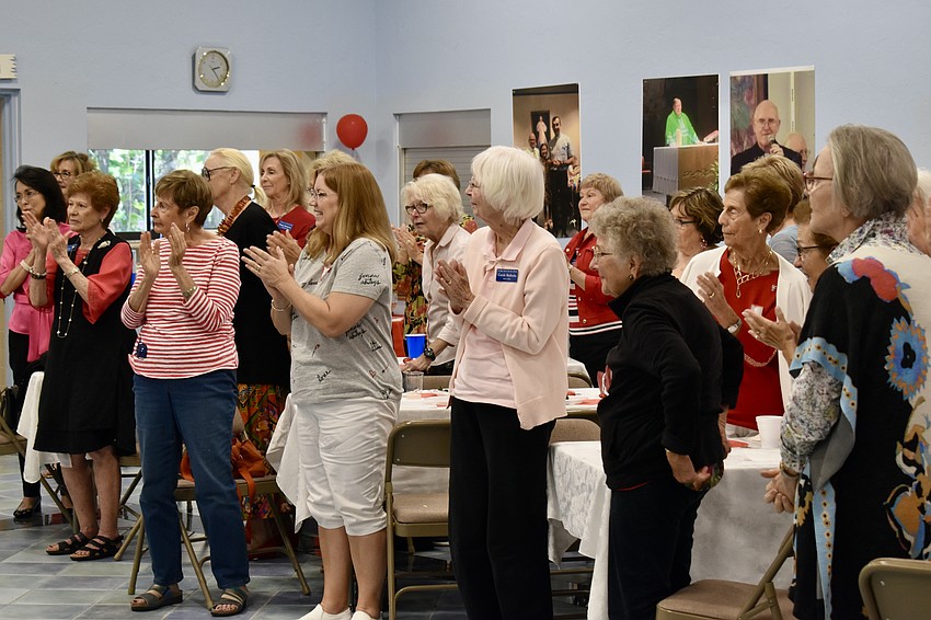 The dancers receive a standing ovation from the ladies guild.