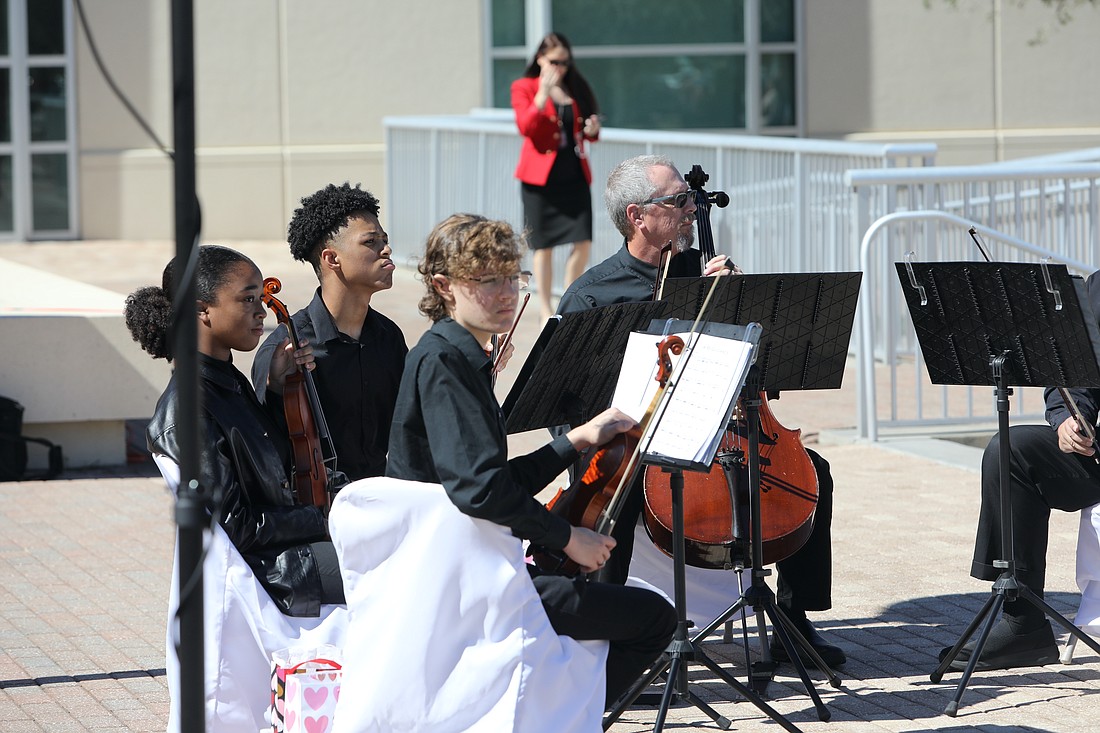 A Flagler Youth Orchestra string quartet played at the Valentine's Day wedding ceremony on the Flagler County Courthouse steps on Feb. 14, 2023. From left, Jack Lisenby, Gabriella Williams, Austin Williams and FYO artistic director Joe Corporon. File photo by Brent Woronoff