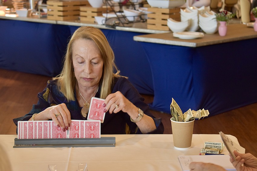 Sheila Pizer organizes her cards.