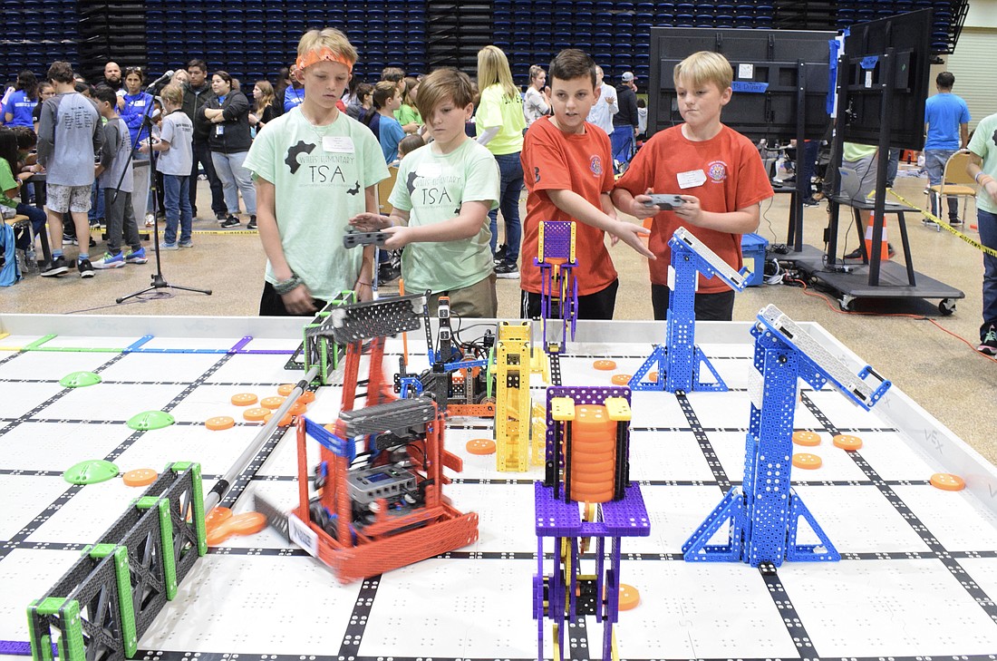 Robert E. Willis Elementary School fifth graders Landon Cuervo and Zachary Danahy compete in an alliance with Gilbert W. McNeal Elementary School fifth graders Hayden Laning and Noah Jackson. The two teams will share the points earned.