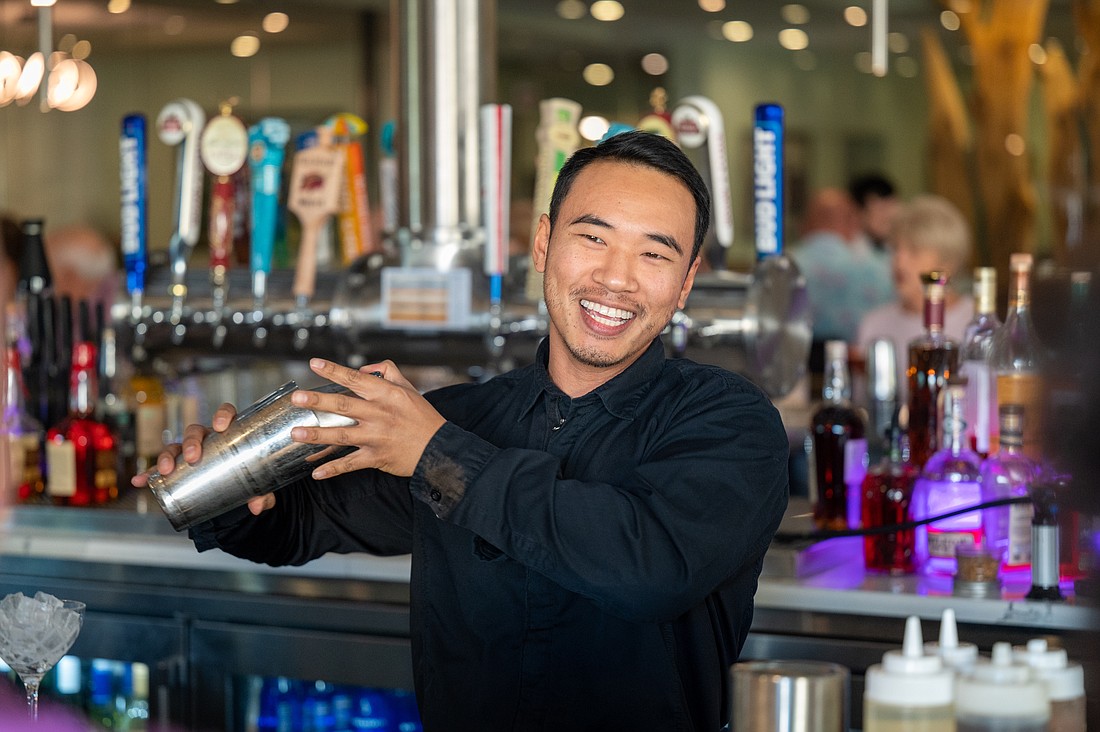 Grove bartender Billy Sapadith is a pro at keeping happy hour happy.