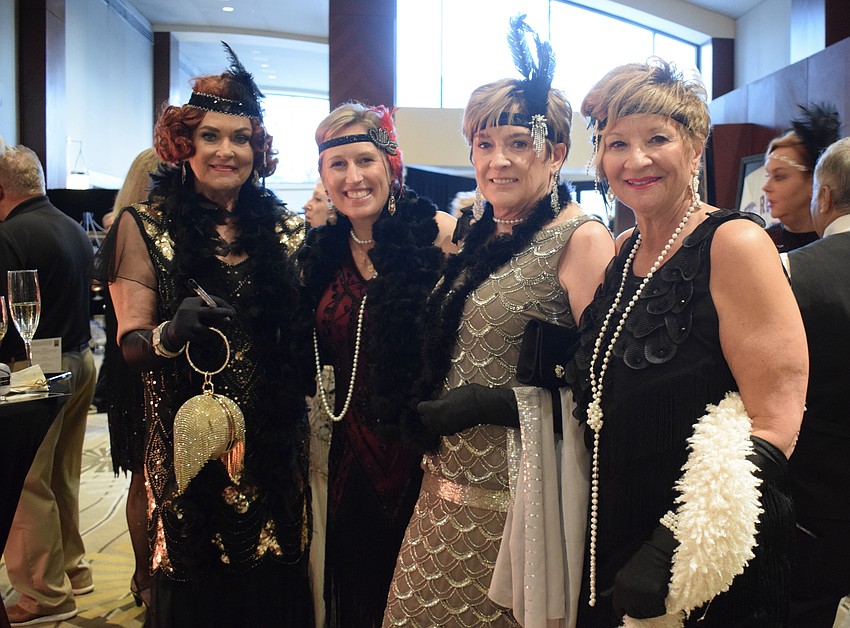 Sarasota's Glo Reber, River Strand's Morgan Roberts, Karen Burness, who is visiting from Connecticut, and Lakewood Ranch's Maria MacDonald go all out for the 1920s Gatsby theme.