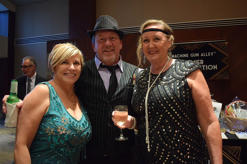 Sisterhood for Good founder Angela Massaro-Fain visits with Lakewood Ranch's Mike and Kathy Fraley. 