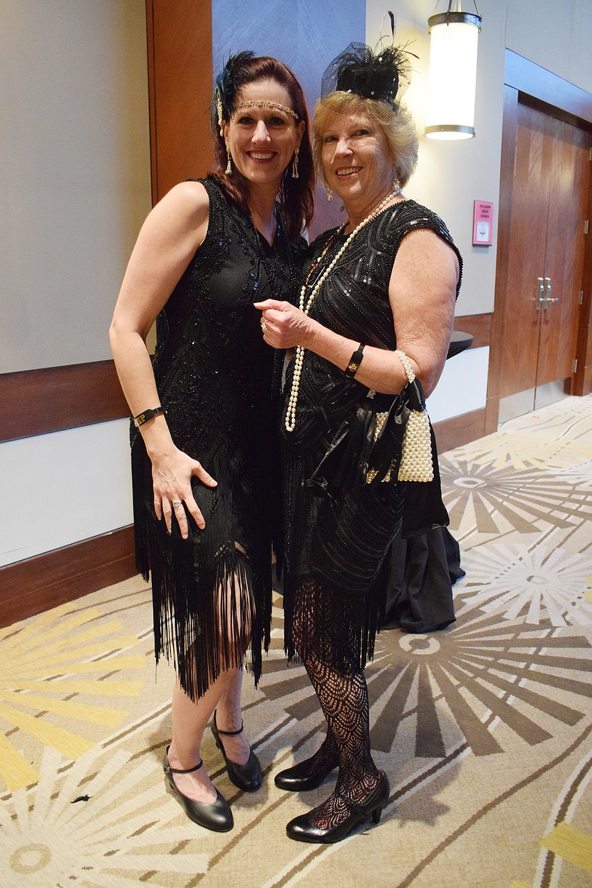 Sarasota's Robin Scarsone and Kathy Collums have fun at Sisterhood for Good's Gatsby Speakeasy Soirée.